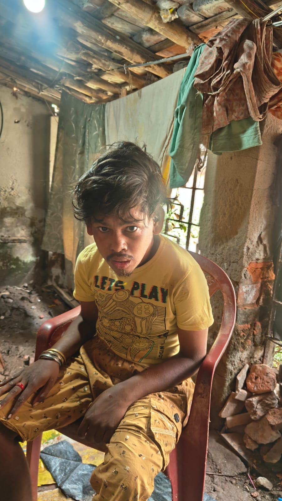 Young disabled boy in his home