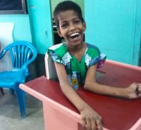 shuktara home for disabled girls - 2016 June - Guria in standing frame smiling