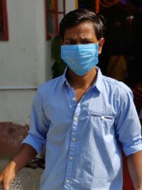 shuktara - Bapi in a blue shirt and mask