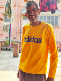 shuktara - man wearing a bright yellow adidas long sleeved shirt