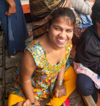 girl in printed dress smiling